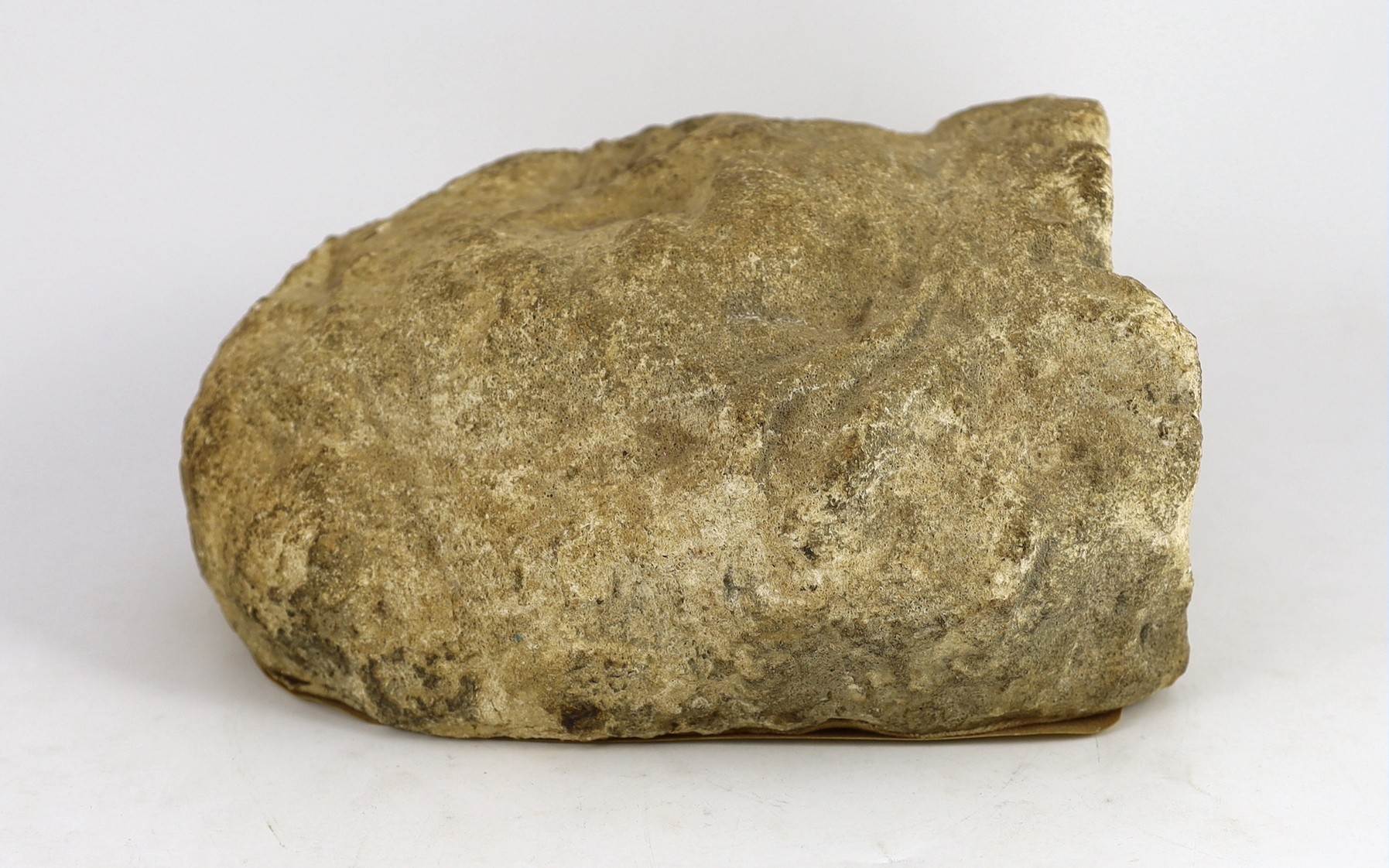 An English carved limestone head of a bearded king, possibly Anglo-Saxon, 25cm high 22.5cm wide